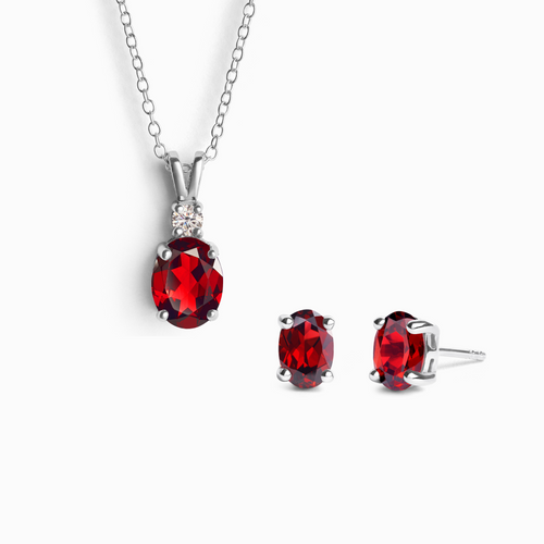 Garnet jewellery set with necklace and earrings in sterling silver on white background