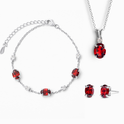 Garnet jewellery set in sterling silver on white background