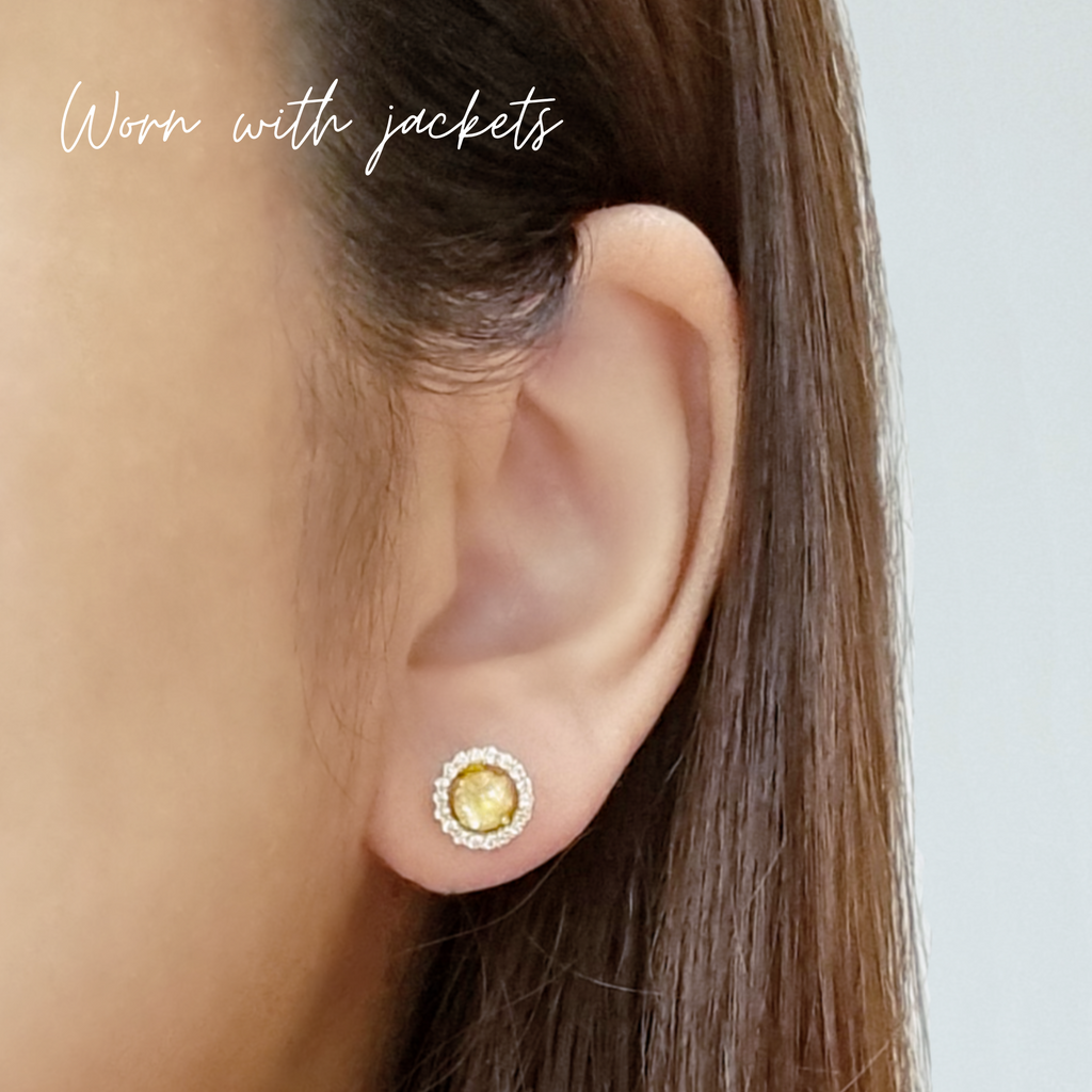 Yellow citrine halo stud earrings in sterling silver lifestyle image
