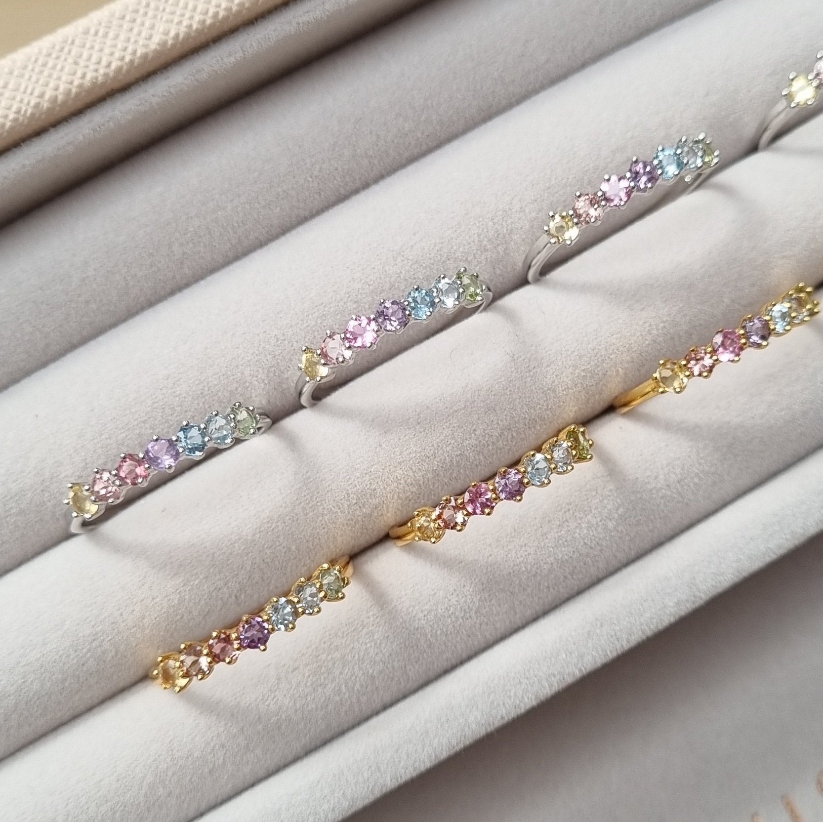 Pastel rainbow gemstone ring lifestyle image