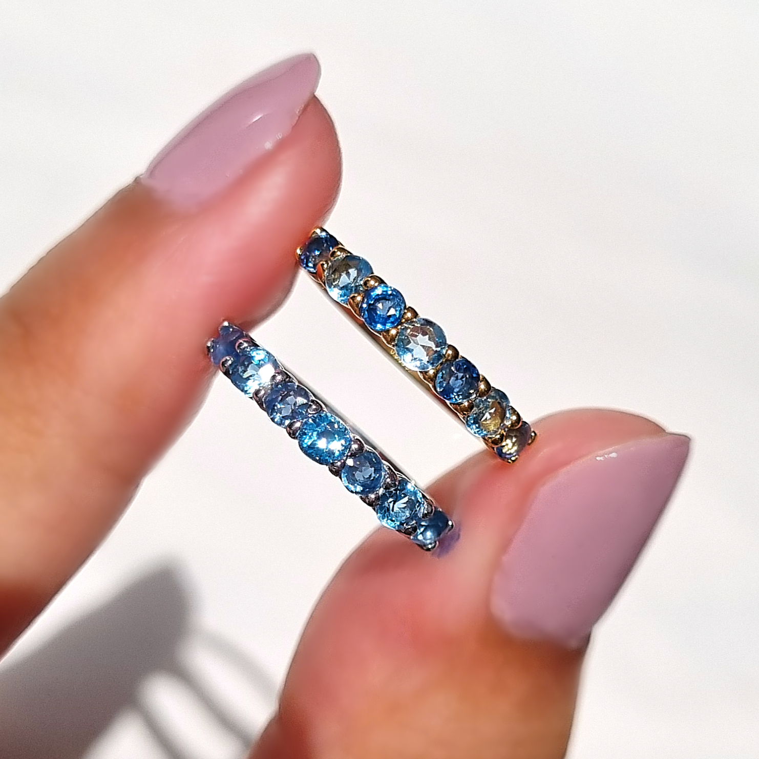 Blue sapphire and blue topaz half eternity band in sterling silver lifestyle image