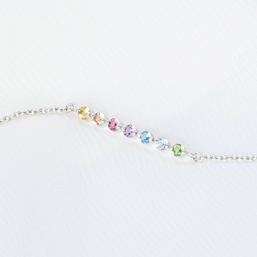 Pastel rainbow gemstone bracelet in sterling silver on white background detail
