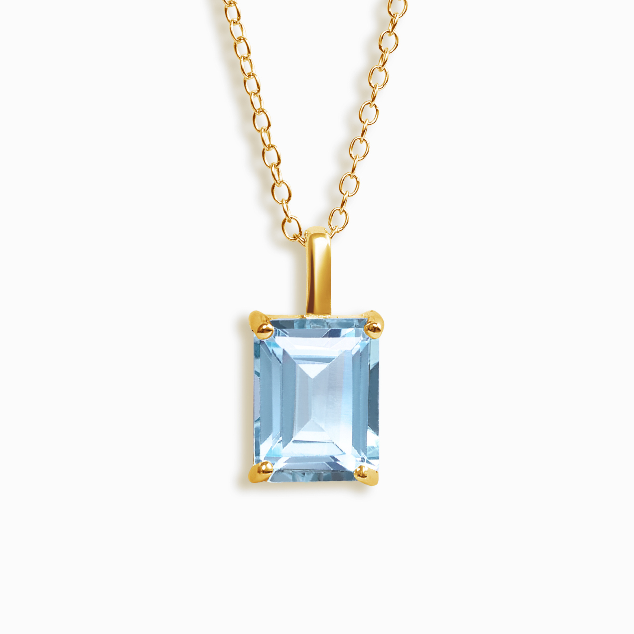 Blue topaz emerald cut pendant necklace in 18k gold vermeil on white background