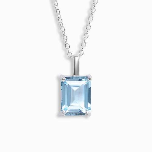 Blue topaz emerald cut pendant necklace in sterling silver on white background