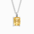 Citrine emerald cut pendant necklace in sterling silver on white background
