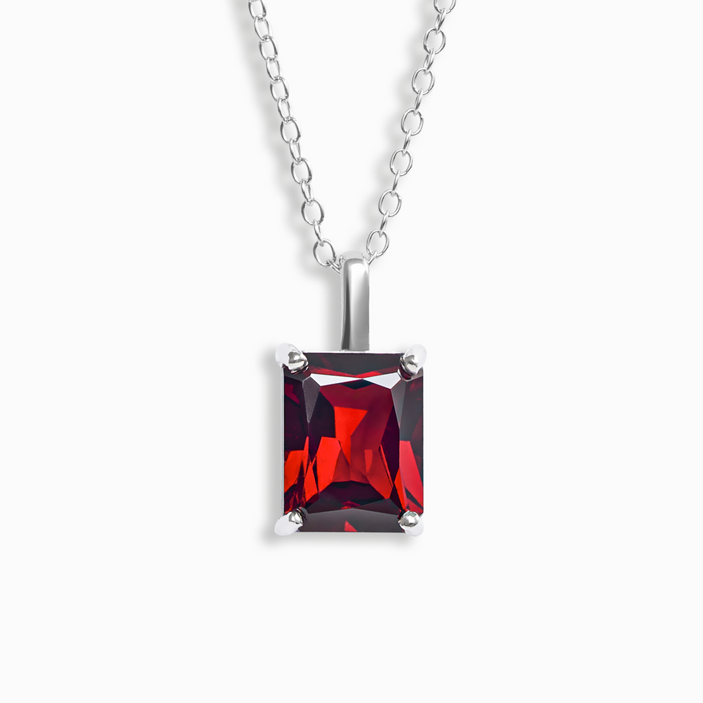 Garnet emerald cut pendant necklace in sterling silver on white background