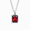 Garnet emerald cut pendant necklace in sterling silver on white background