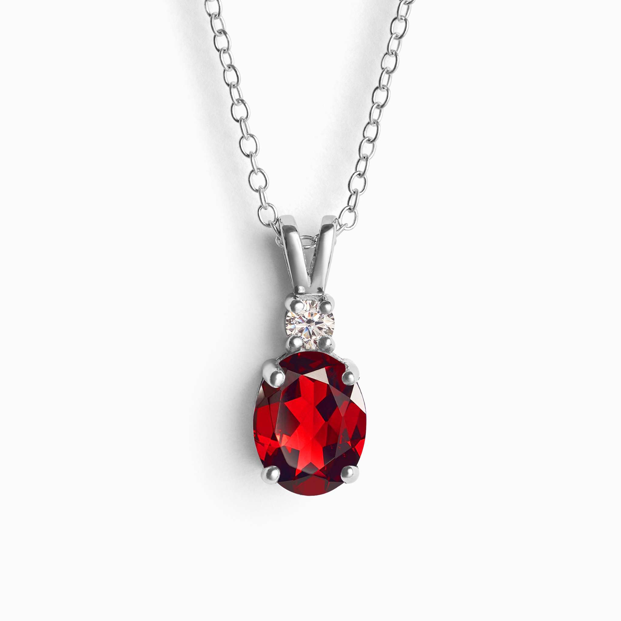 Garnet pendant necklace in sterling silver on white background