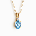 Blue topaz pendant necklace in 18k gold vermeil on white background