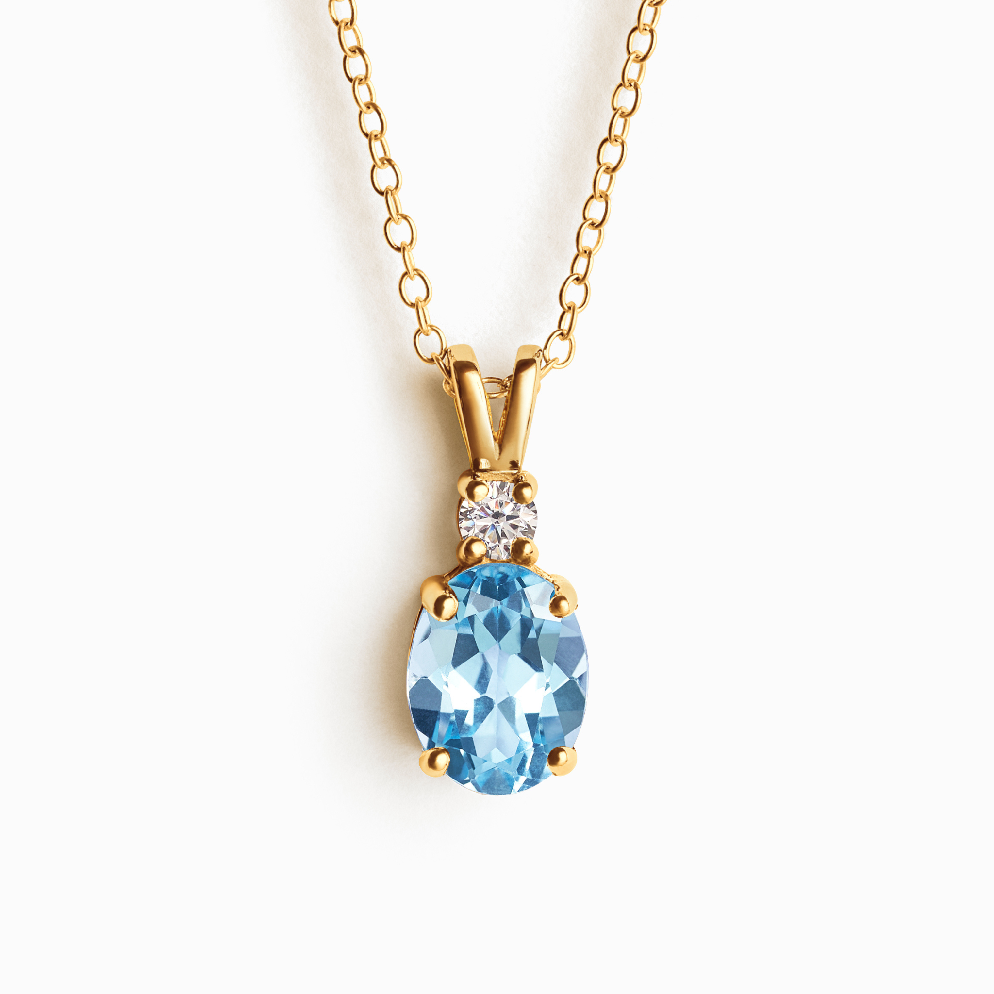 Blue topaz pendant necklace in 18k gold vermeil on white background
