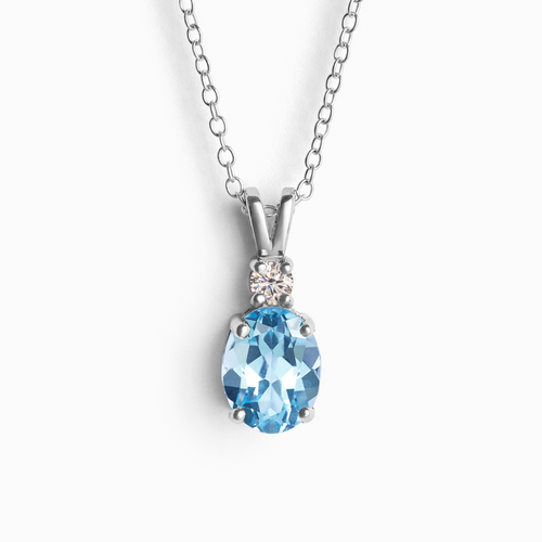 Blue topaz pendant necklace in sterling silver on white background