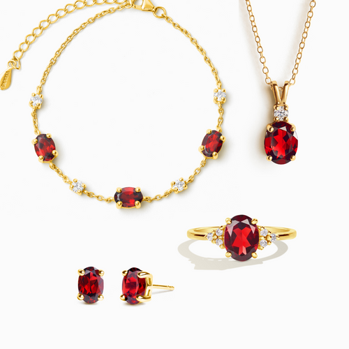Garnet complete jewellery set in 18k gold vermeil on white background
