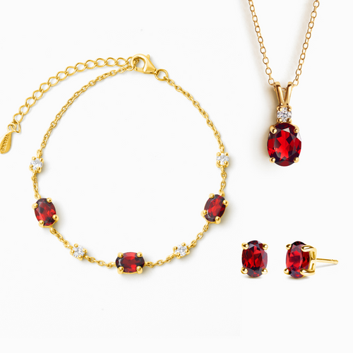 Garnet jewellery set in 18k gold vermeil on white background