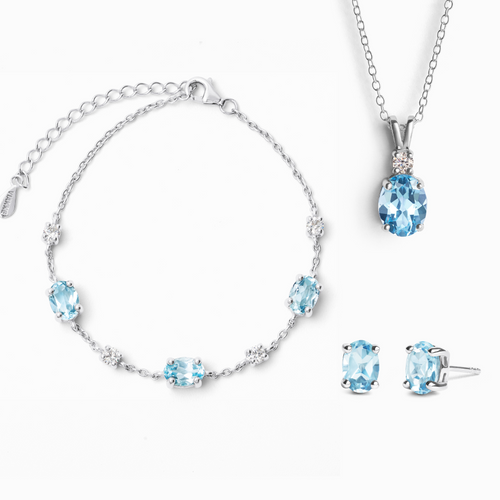Blue topaz jewellery set in sterling silver on white background