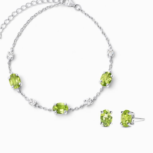 Peridot jewellery set in sterling silver on white background