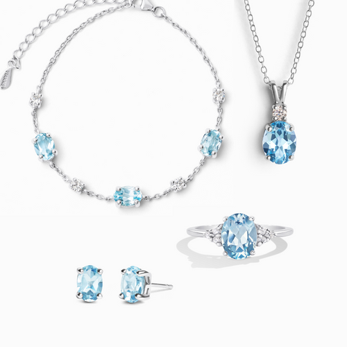 Blue topaz complete jewellery set in sterling silver on white background