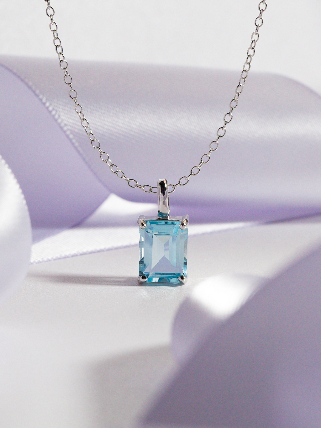 Blue topaz emerald cut pendant necklace in sterling silver detail image