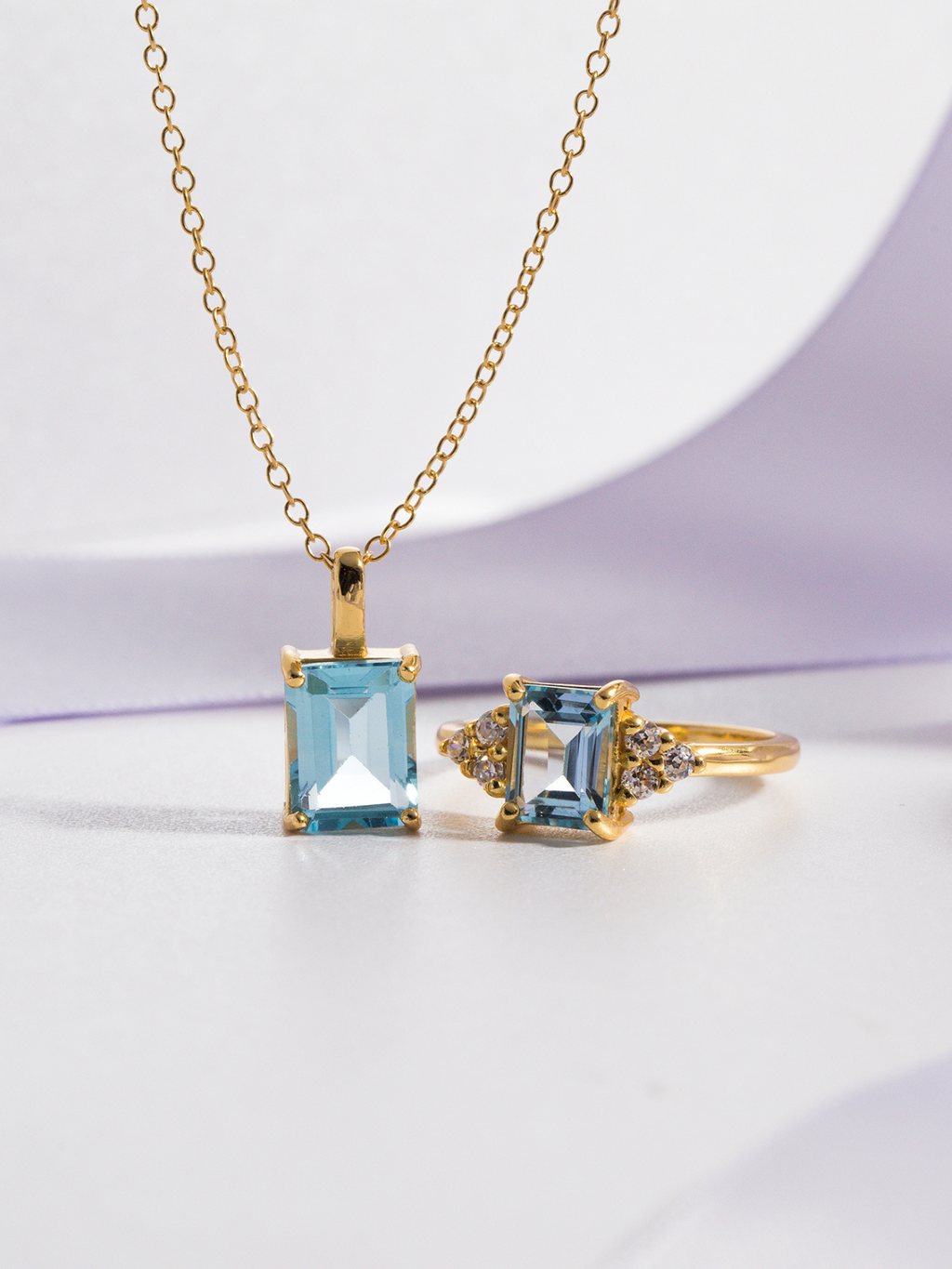 Blue topaz emerald cut ring and necklace in 18k gold vermeil