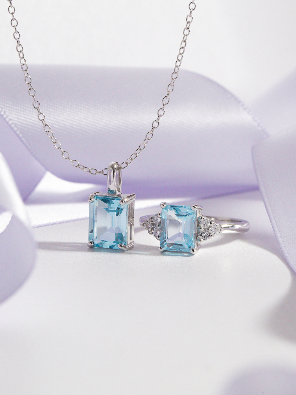 Blue topaz emerald cut ring and necklace in sterling silver