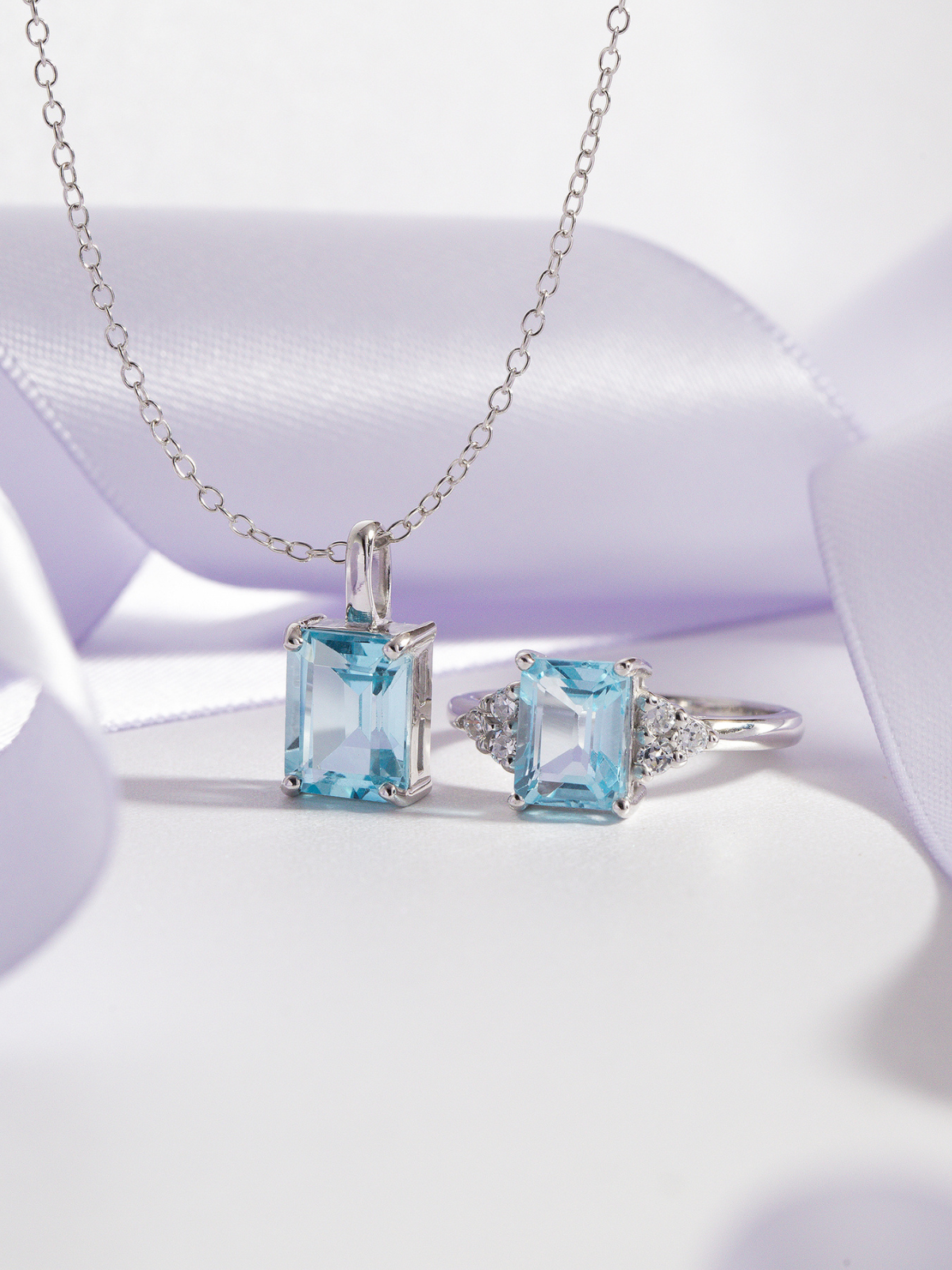 Blue topaz emerald cut ring and necklace in sterling silver