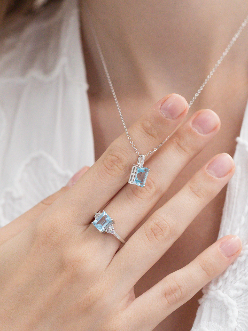 Blue topaz emerald cut ring and necklace in sterling silver model image