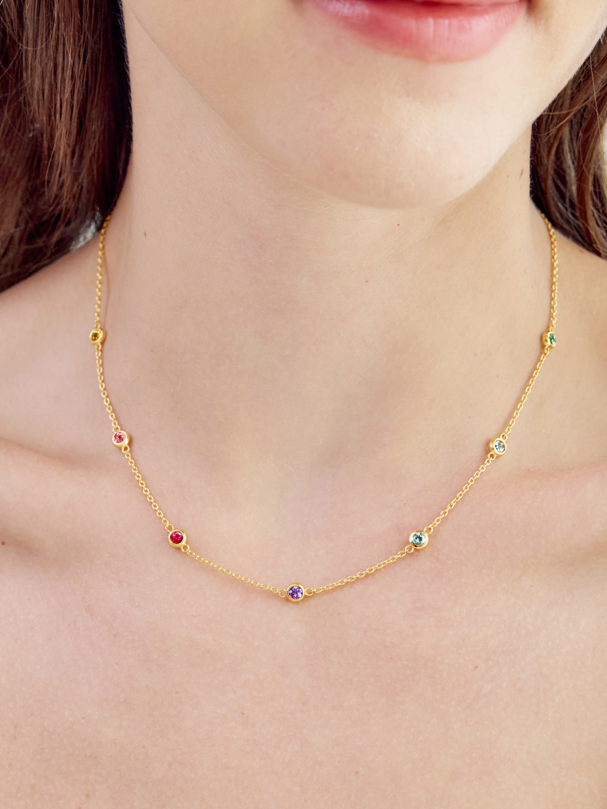 Rainbow gemstone necklace in sterling silver on model