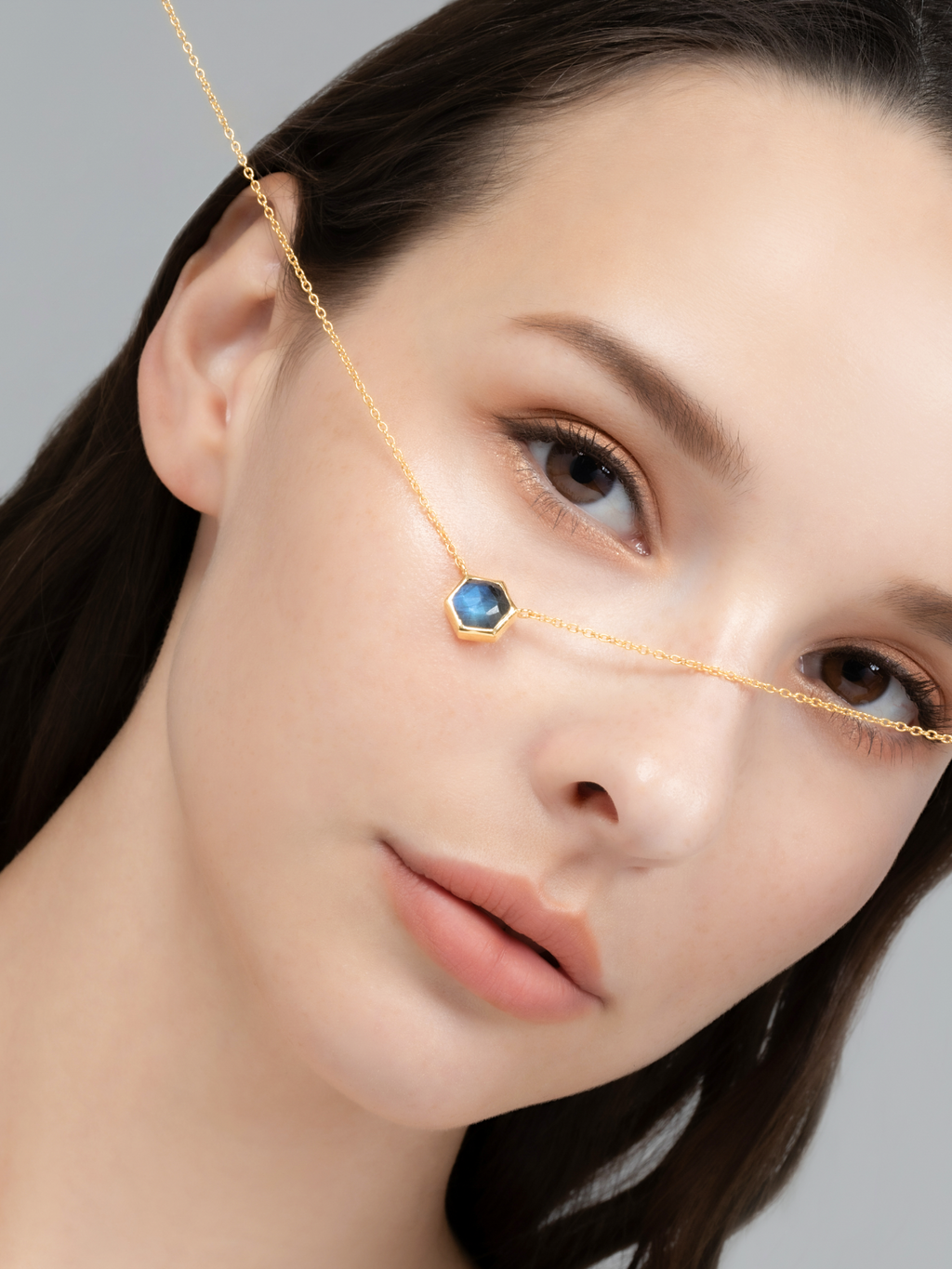 Model wearing labradorite hexagon pendant necklace in 18k gold vermeil