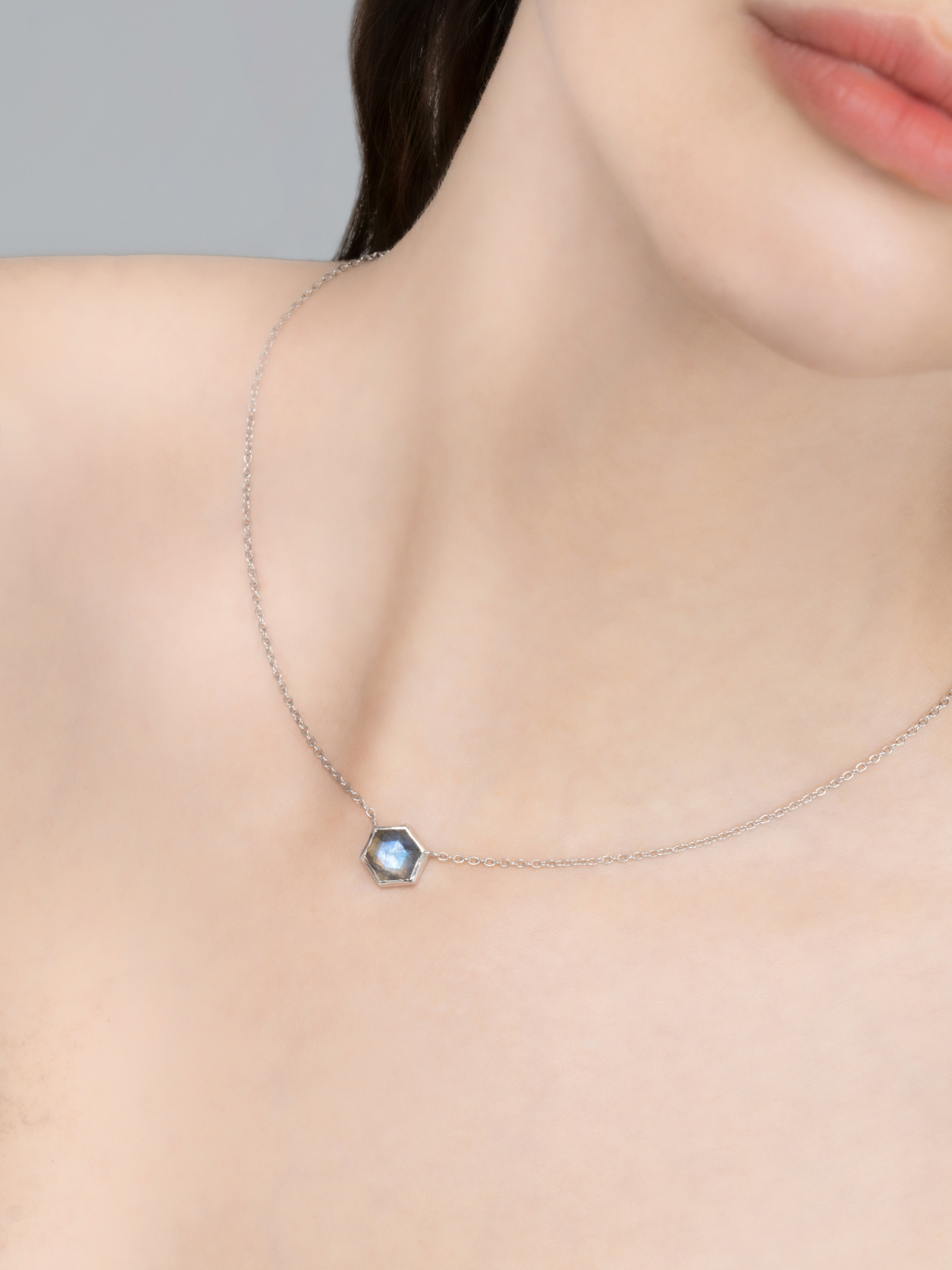 Model wearing labradorite hexagon pendant necklace in sterling silver