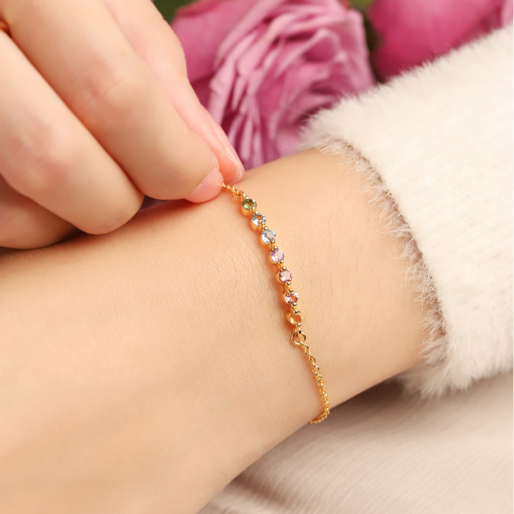 Pastel rainbow gemstone bracelet in 18k gold vermeil on hand