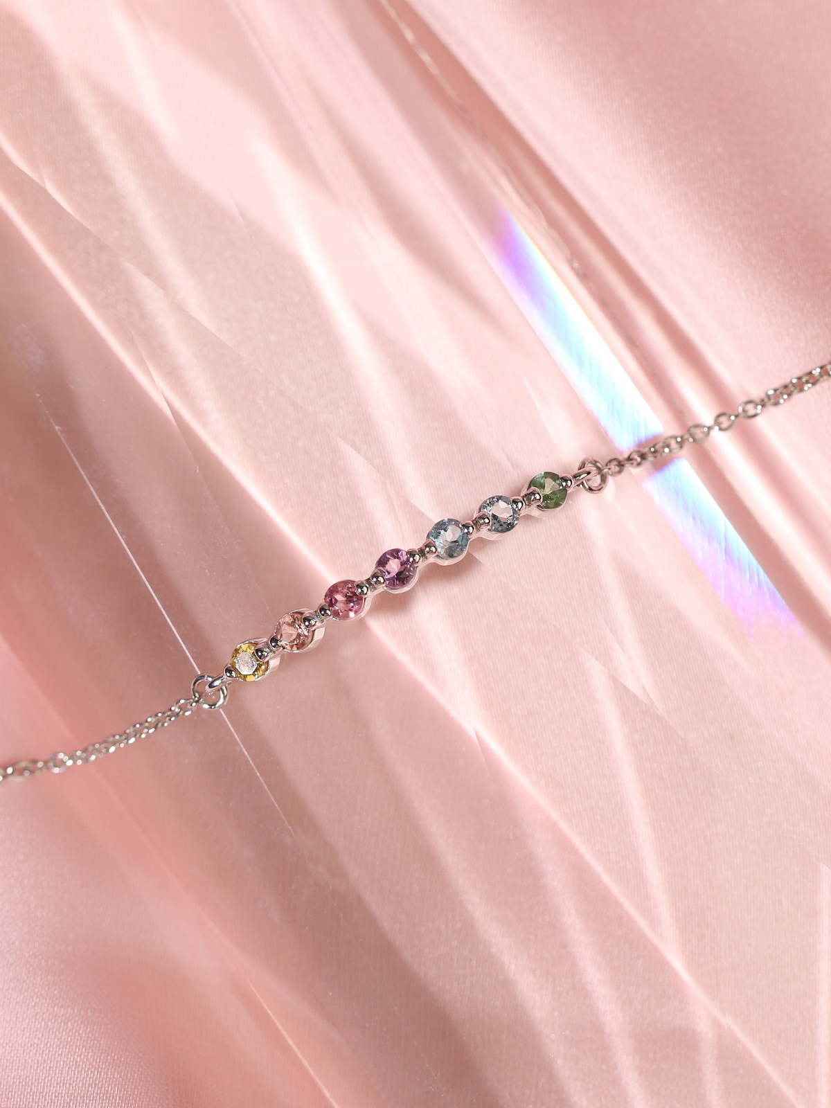 Pastel rainbow gemstone bracelet in sterling silver lifestyle image