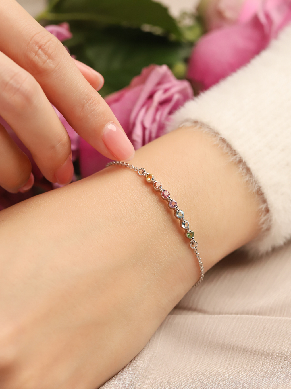 Pastel rainbow gemstone bracelet in sterling silver on hand