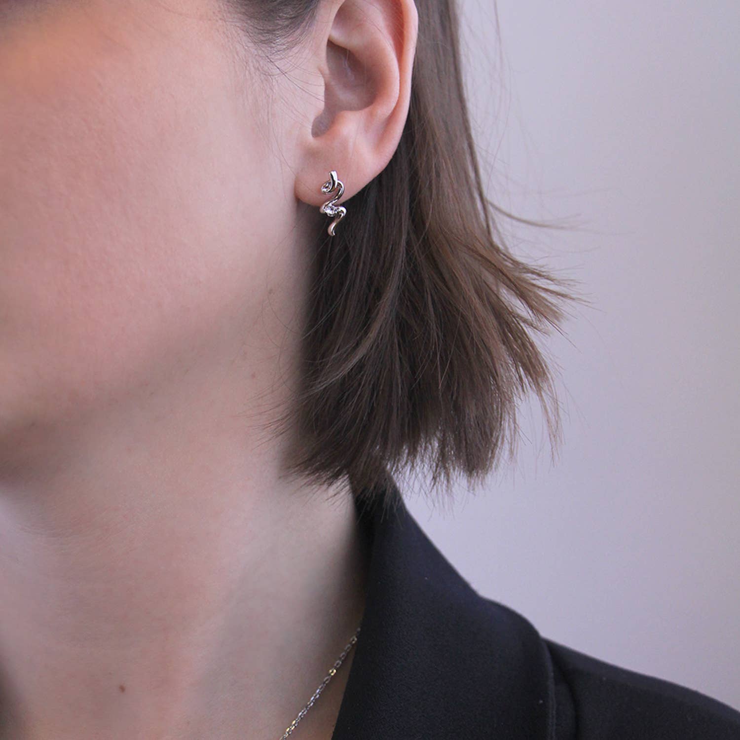 Silver spiral earrings close-up detail