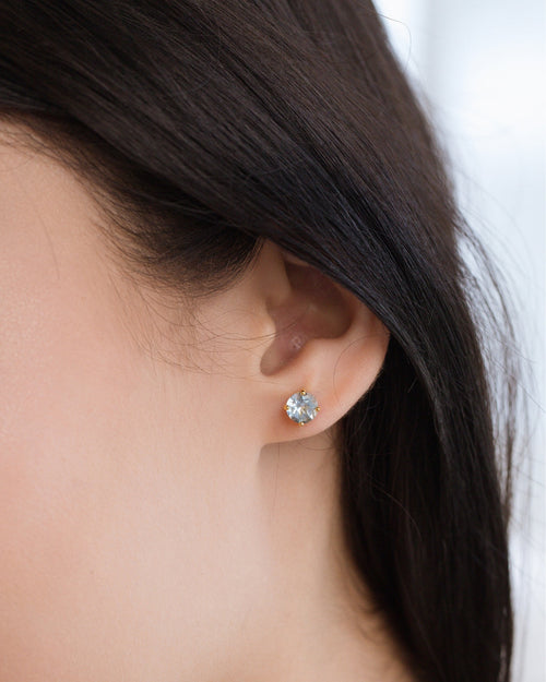 Blue topaz round stud earrings in 18k gold vermeil model image