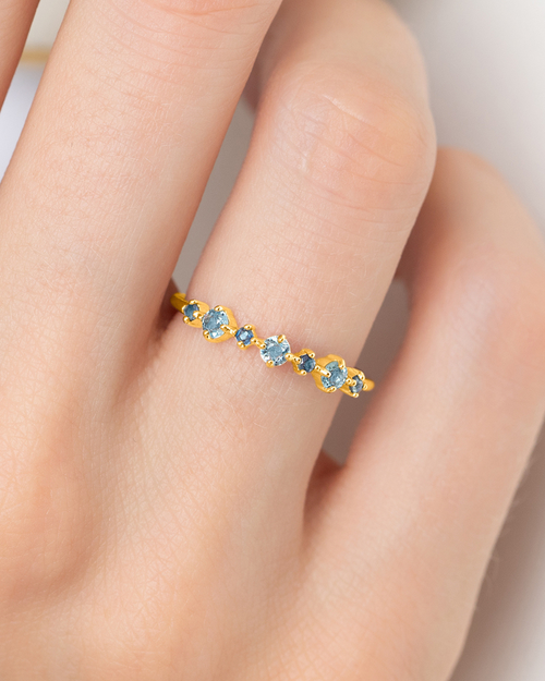 Vianne Jewellery blue sapphire and Swiss blue topaz eternity ring in 18k gold vermeil shown on model