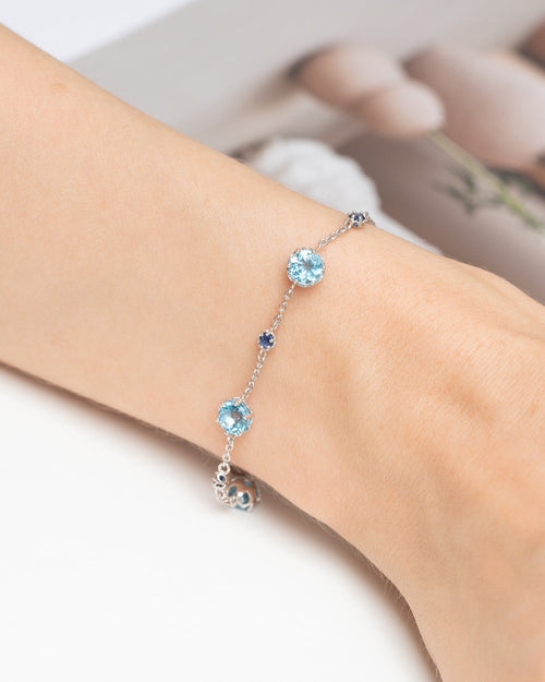 Vianne Jewellery blue sapphire and Swiss blue topaz tennis bracelet in sterling silver shown on model
