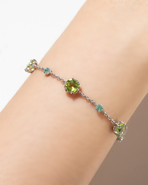 Vianne Jewellery emerald and peridot tennis bracelet and necklace in sterling silver shown on model
