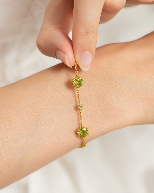 Vianne Jewellery emerald and peridot tennis bracelet in 18k gold vermeil shown on model