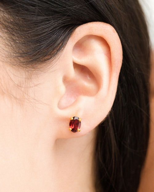 Garnet oval stud earrings in 18k gold vermeil model image