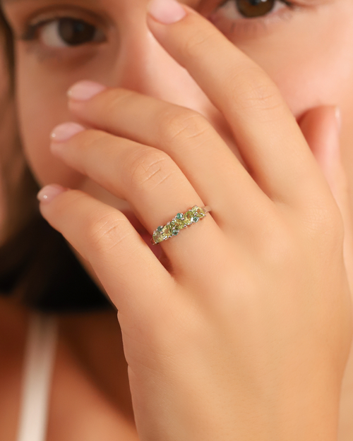 Vianne Jewellery pear cut peridot and emerald eternity ring in sterling silver shown on model