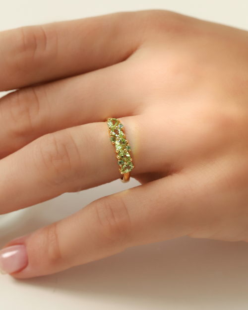 Vianne Jewellery pear cut peridot and emerald eternity ring in 18k gold vermeil shown on model