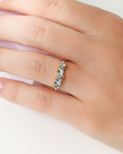 Vianne Jewellery pear cut Swiss blue topaz and blue sapphire eternity ring in 18k gold vermeil shown on model