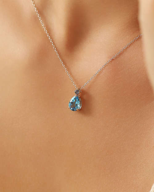 Vianne Jewellery Swiss blue topaz and blue sapphire pendant necklace in sterling silver shown on model
