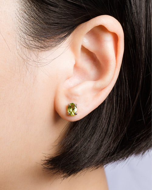 Peridot oval stud earrings in sterling silver model image