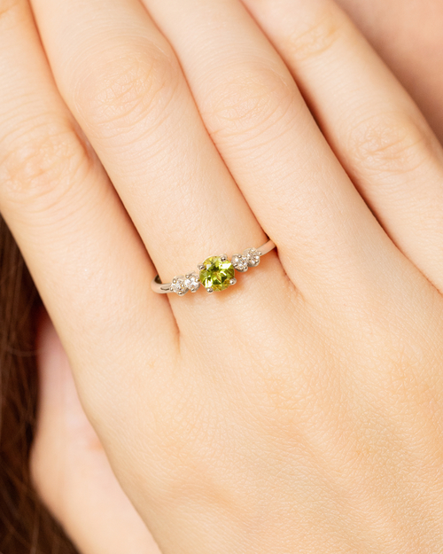 Vianne Jewellery round cut peridot five-stone ring in sterling silver shown on model