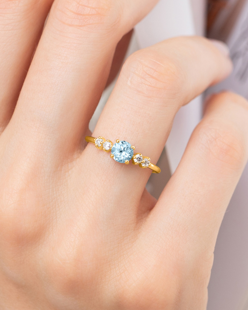 Sky blue topaz five stone ring in 18k gold vermeil on model