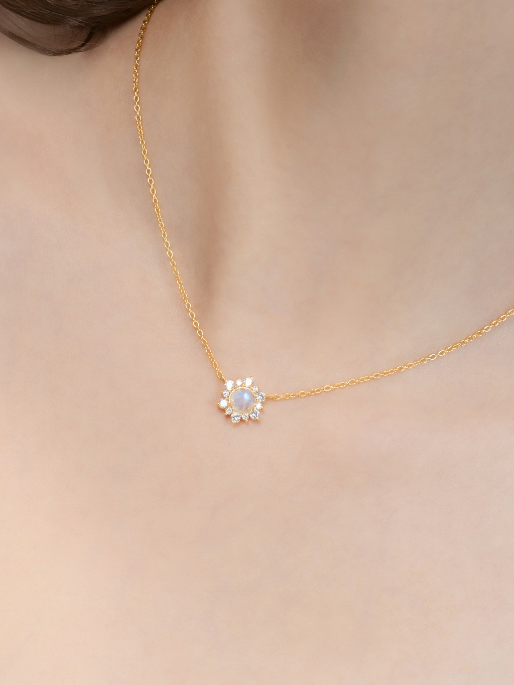 Model wearing rainbow moonstone necklace in 18k gold vermeil