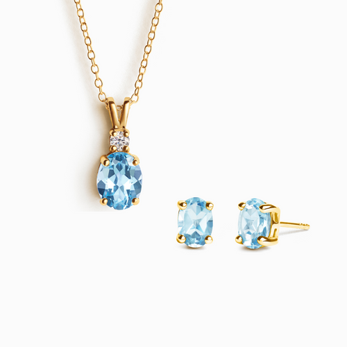 Blue topaz jewellery set with necklace and earrings in 18k gold vermeil on white background