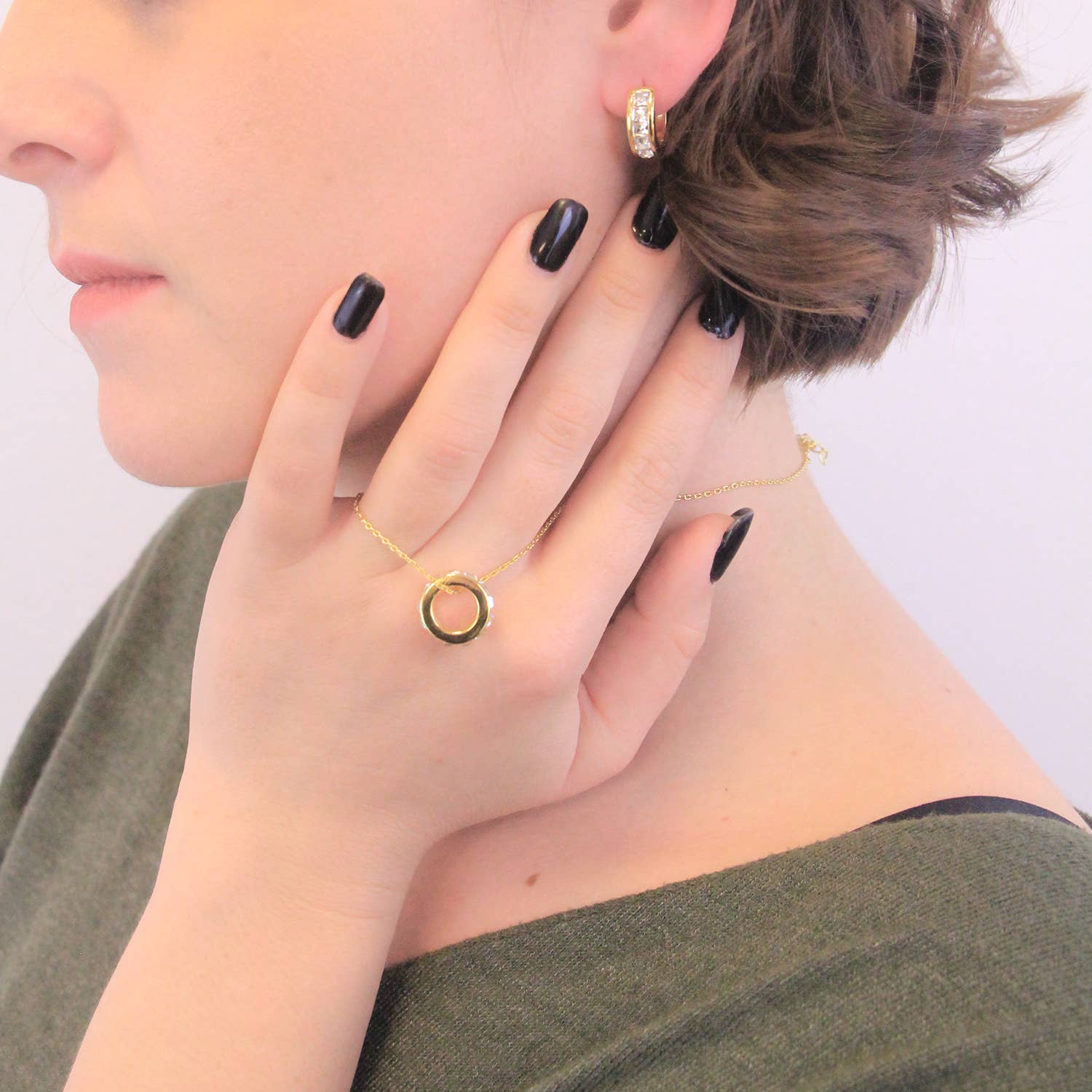 Gold crystal square hoop earrings close-up view