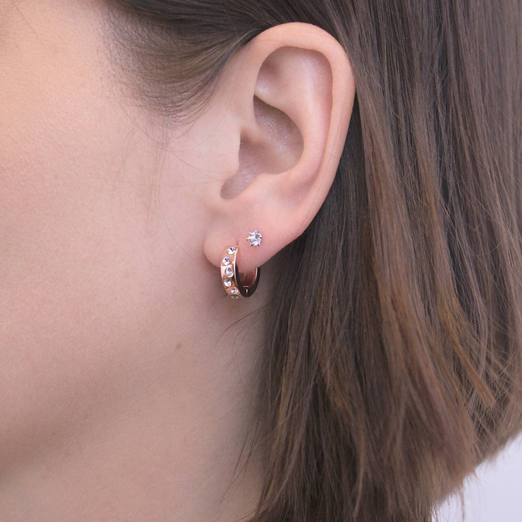 Joy rose gold crystal earrings angled view