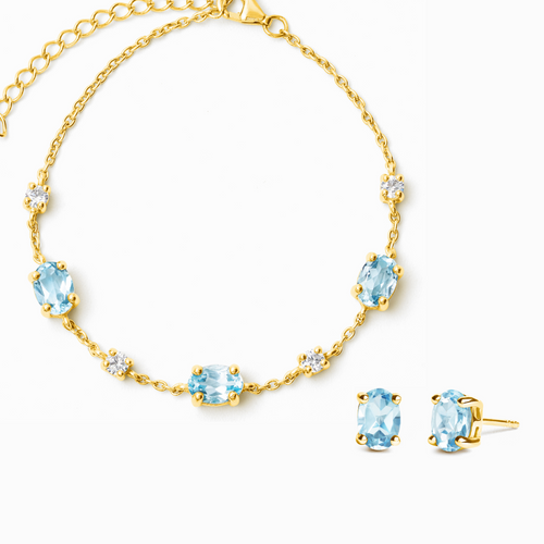 Blue topaz jewellery set with bracelet and earrings in 18k gold vermeil on white background